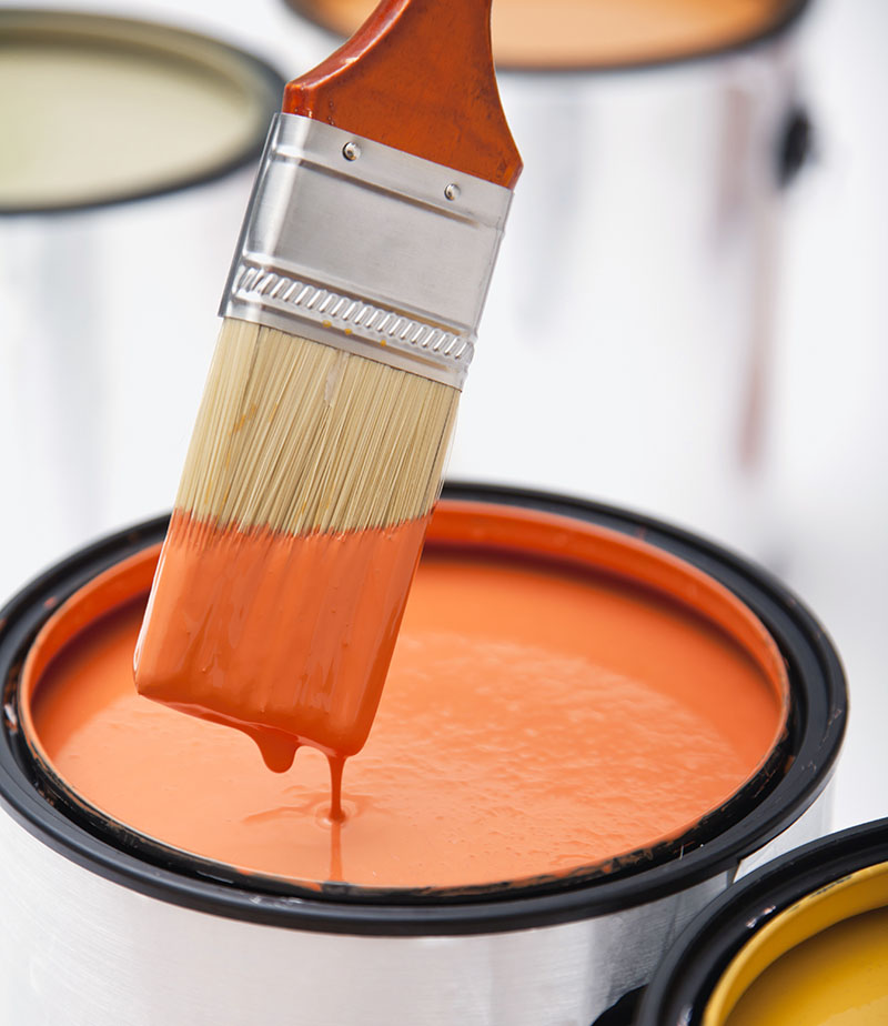 Orange paint and brush